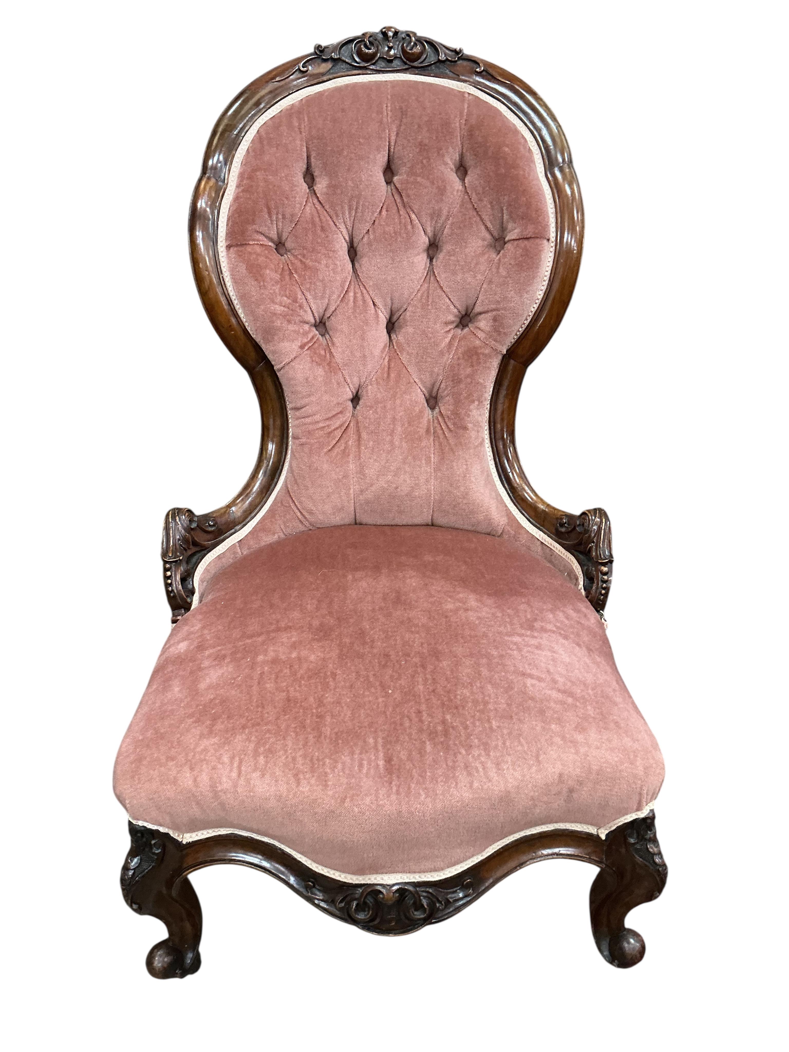 A Victorian mahogany spoon back nursing chair and a circular footstool, diameter 60cm